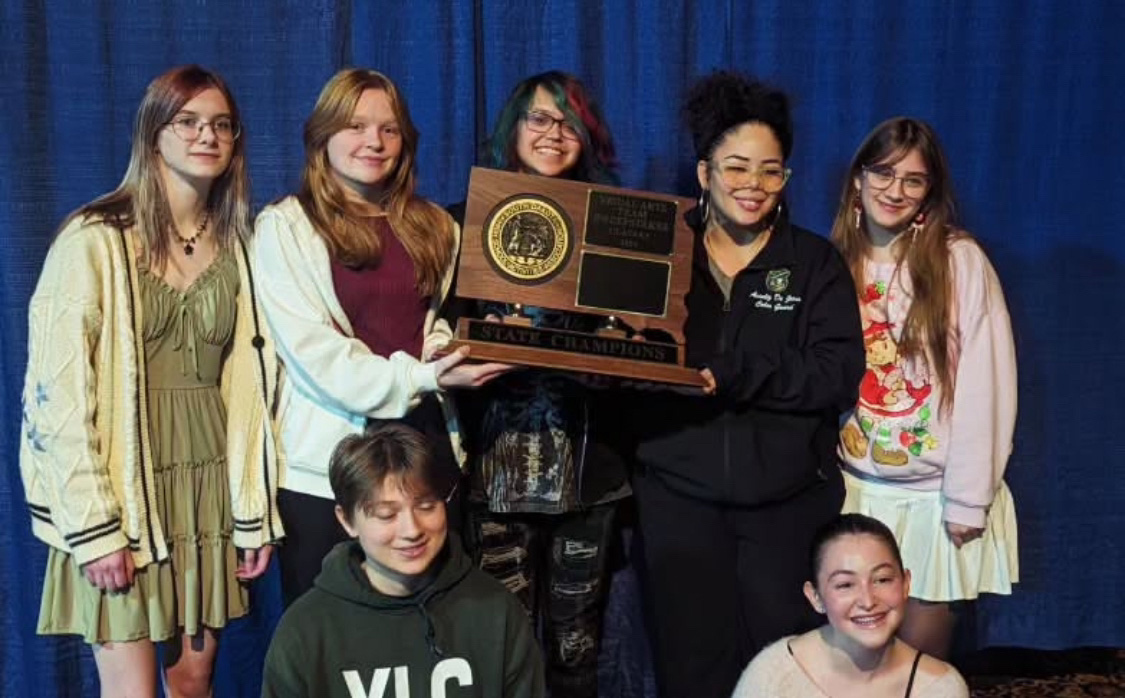 Artwars State Championship trophy with me and other Jefferson Highschool students
