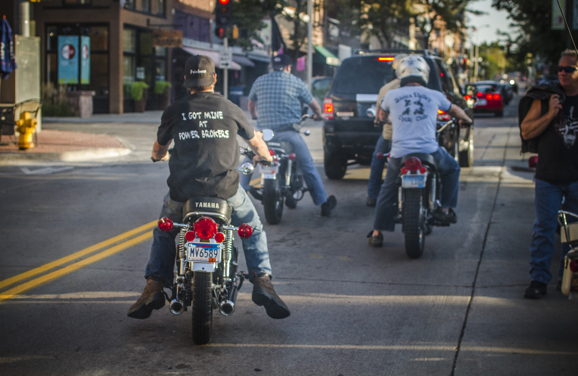 Behind people riding Motorcycles