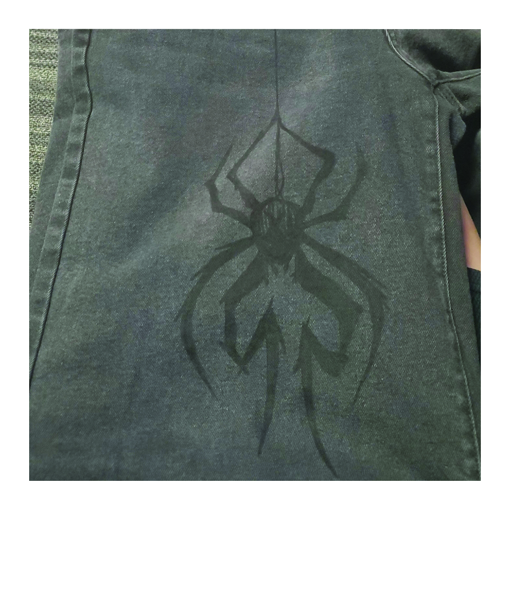 spider drawn on jeans
